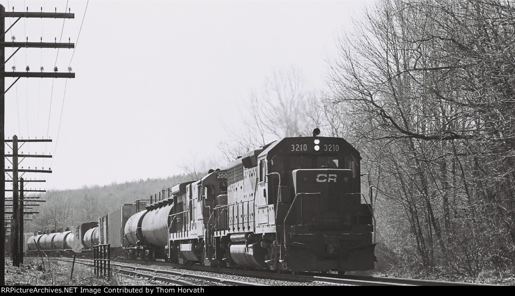 CR 3210 leads a general merchandise freight west at LEHL MP 64